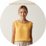 Portrait of Claire Chen, a young woman with a warm expression, against a light cream background.